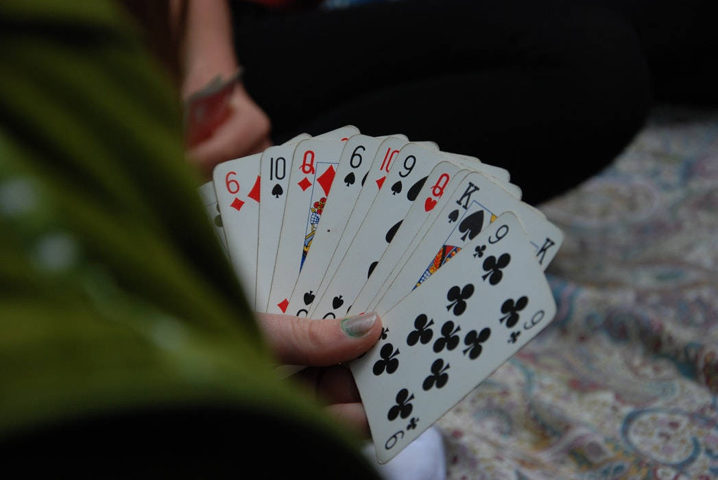 Caption: Euchre Player's Hand With Deck Wallpaper