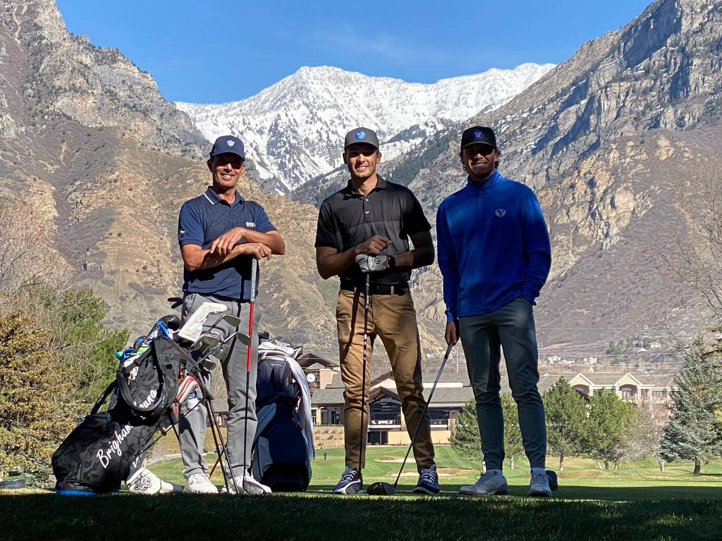 Caption: Golf Professional Mike Weir Standing With Fellow Golfers Wallpaper