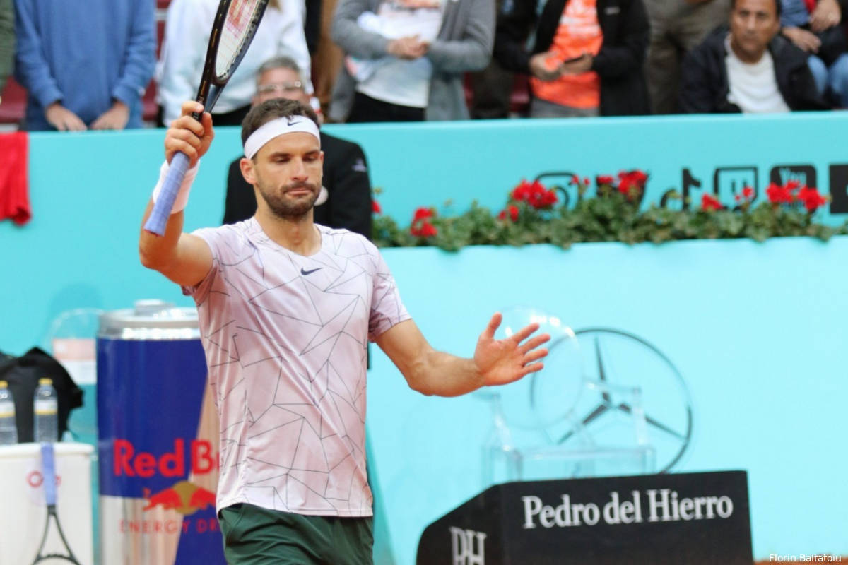 Caption: Grigor Dimitrov In Action - Triumphantly Holds Up Tennis Racket Wallpaper