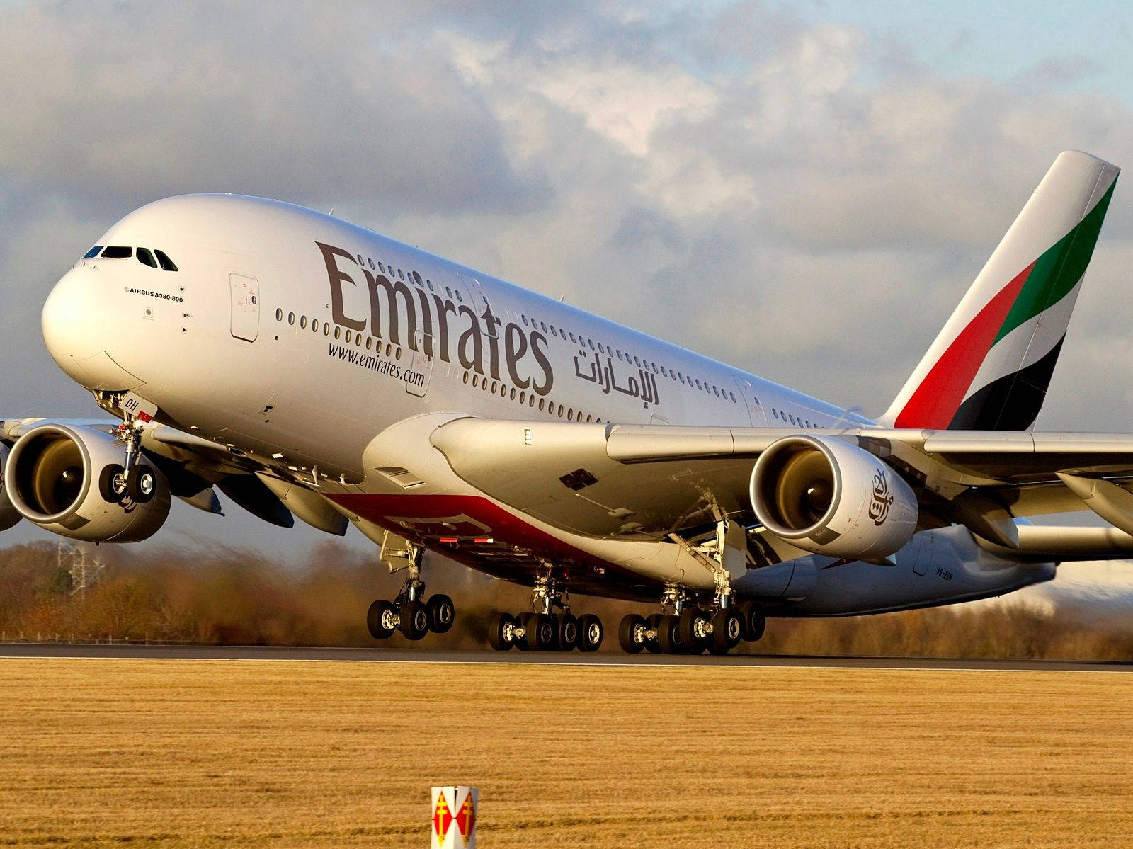 Caption: Majestic Emirates Boeing 777 Model In Sky Wallpaper