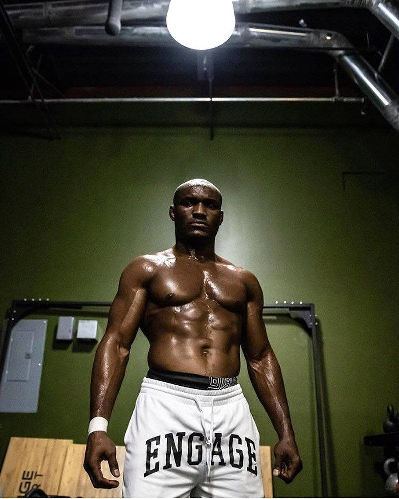 Caption: Mma Champion Kamaru Usman In Engage Fightwear Wallpaper