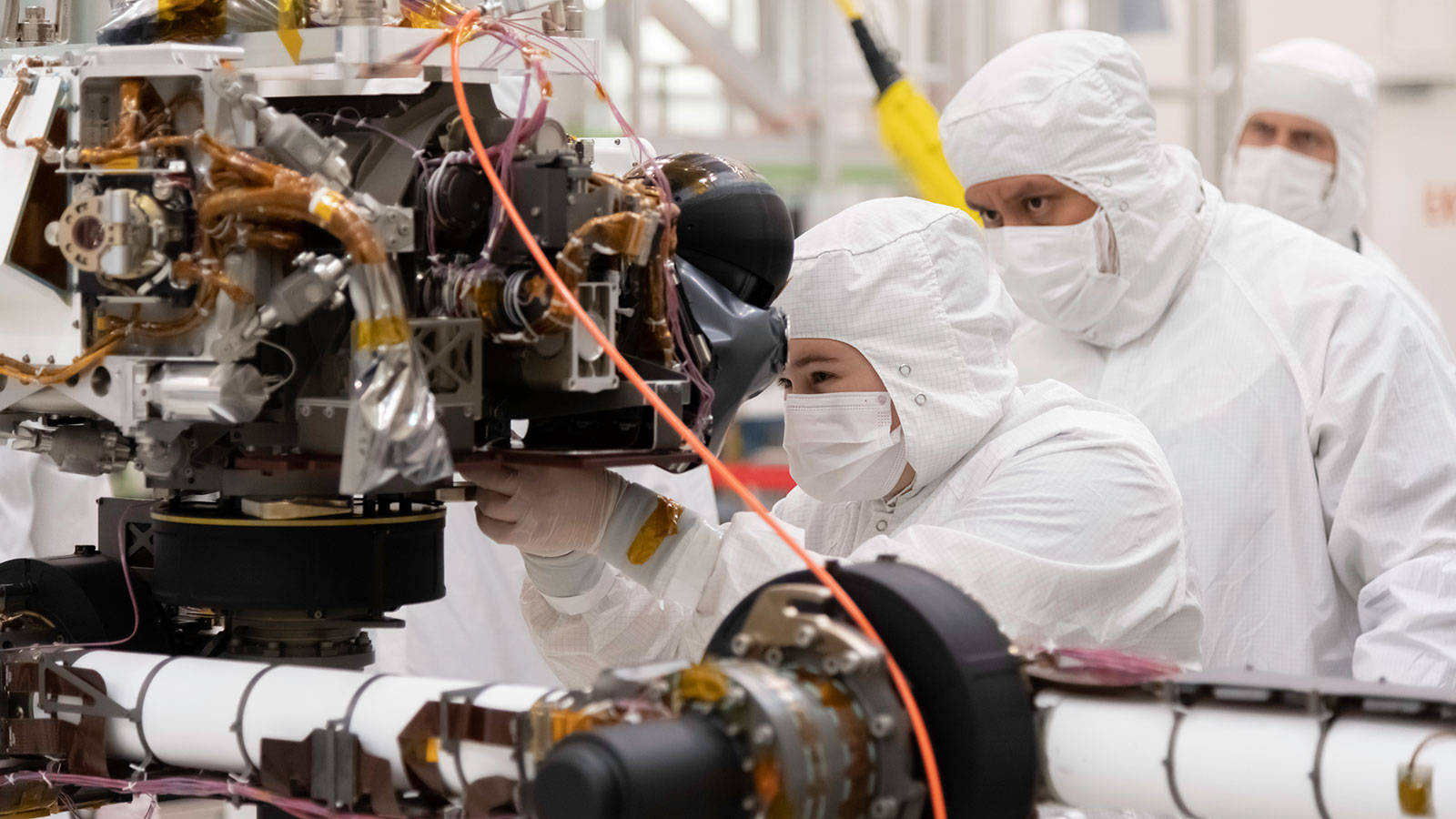 Caption: Nasa Engineering Technician Working On Mars 2020 Perseverance Rover Wallpaper