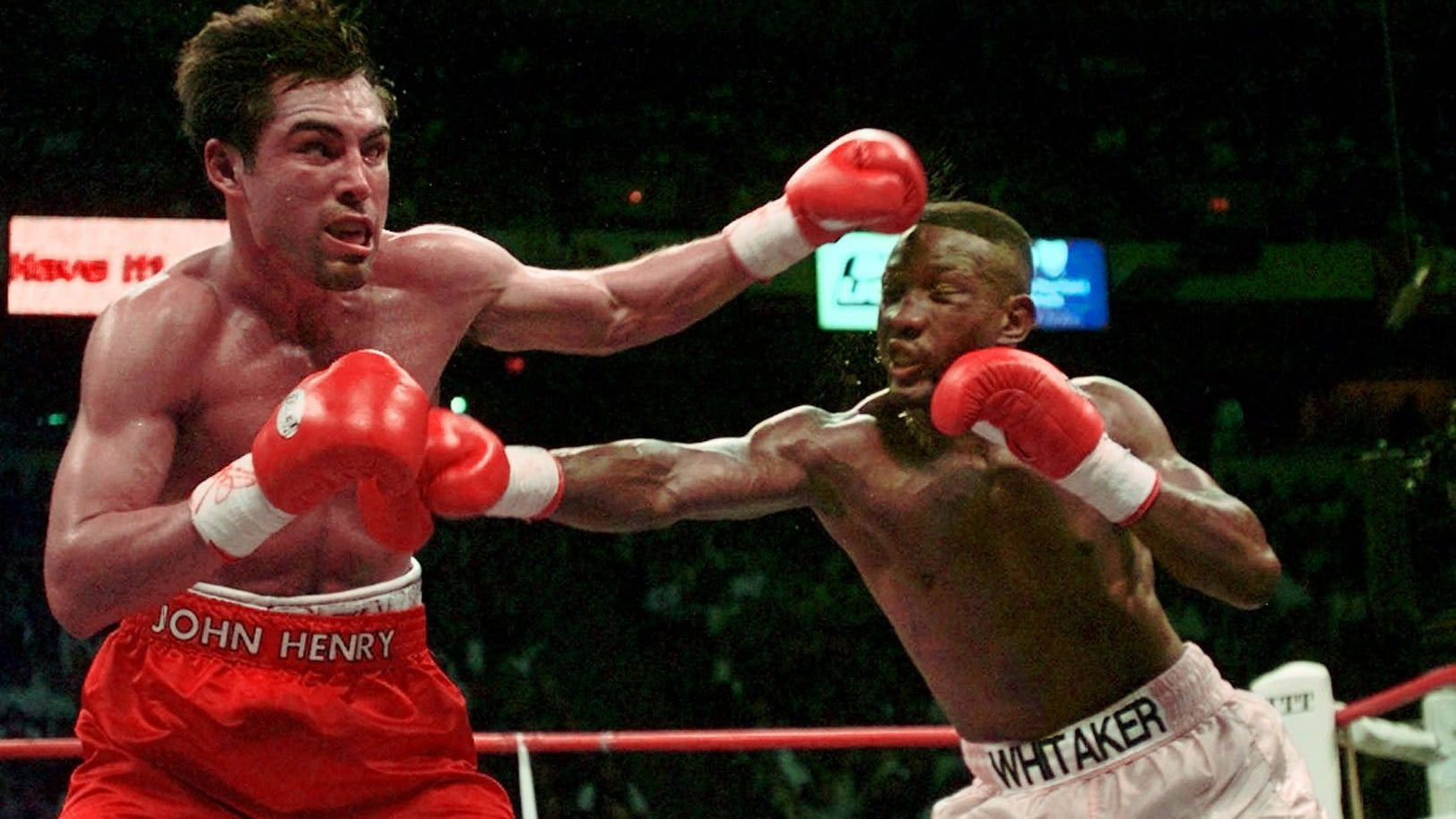 Caption: Pernell Whitaker Masterfully Dodging A Punch In The Ring Wallpaper