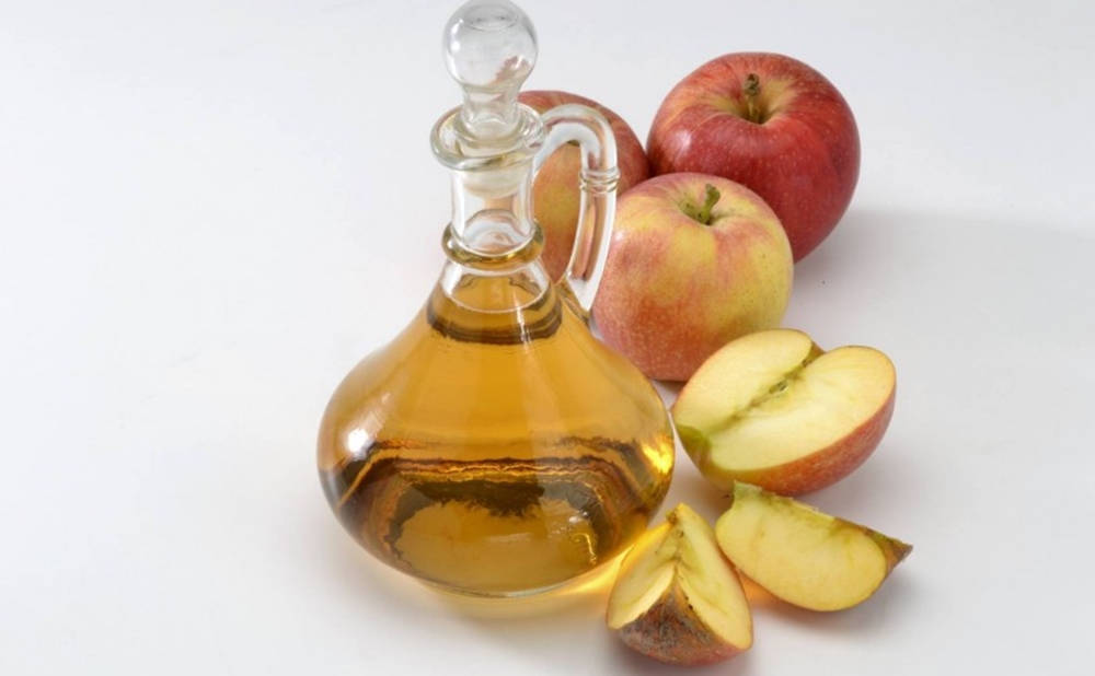 Caption: Pure Apple Cider Vinegar In A Glass Container Wallpaper