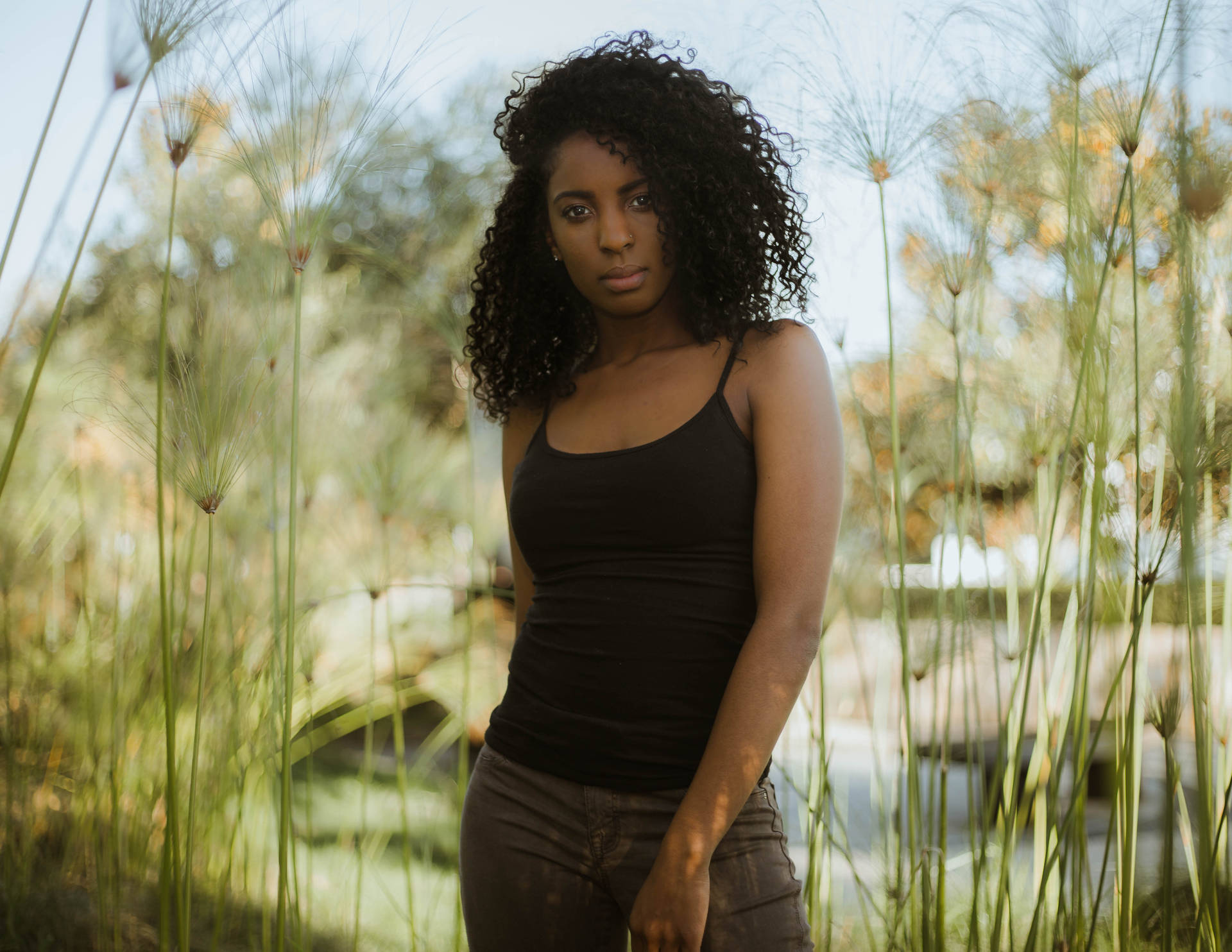 Caption: Radiant Confidence - Portrait Of A Beautiful Black Girl Wallpaper