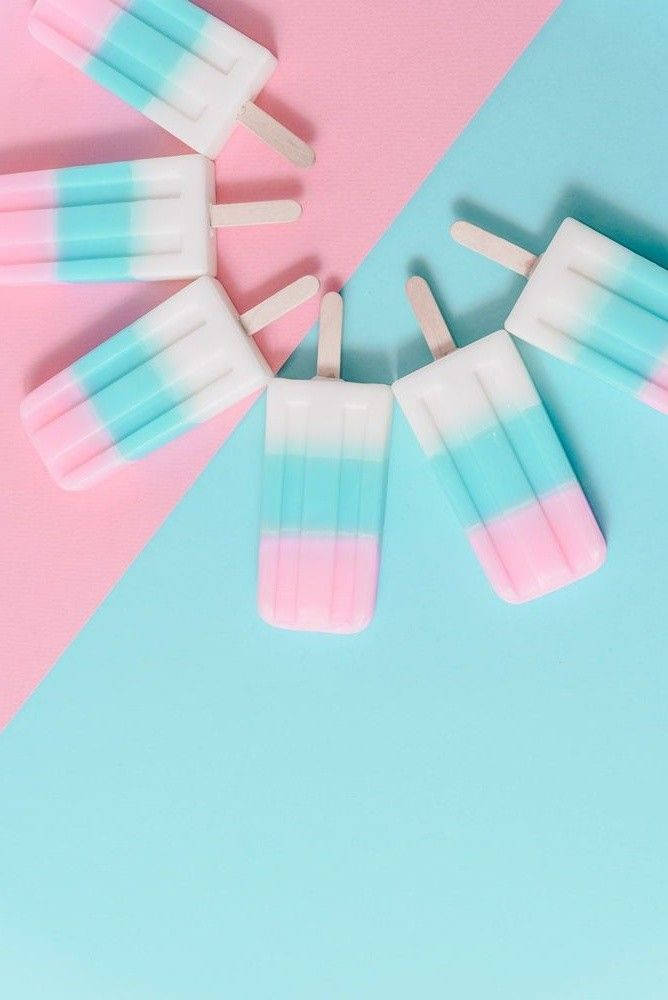 Caption: Refreshing Pink And Blue Popsicles Wallpaper