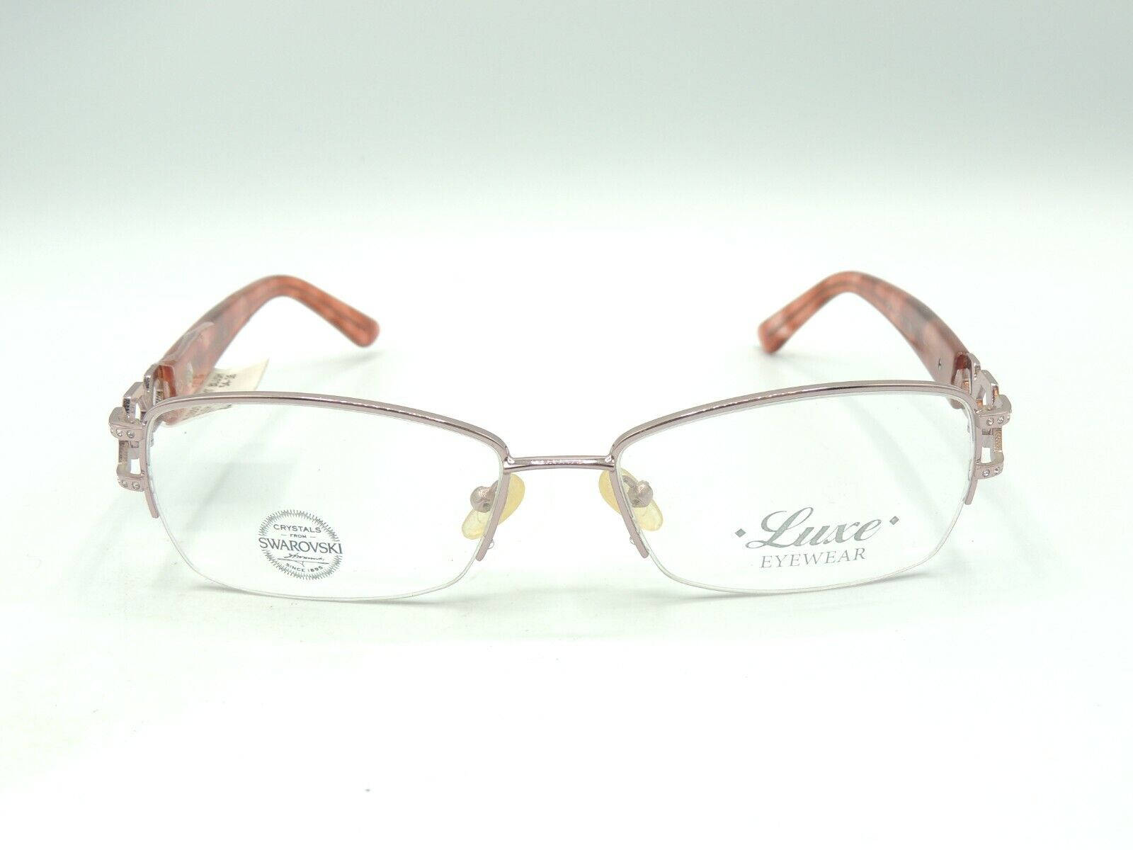 Caption: Stylish Unisex Luxe Eyeglass Embellished With Swarovski Elements Wallpaper