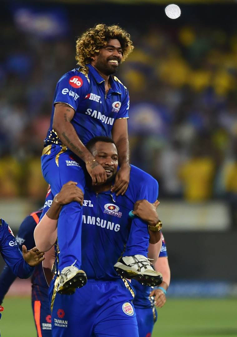 Celebrated Mumbai Indians Players Malinga And Pollard In Action. Wallpaper