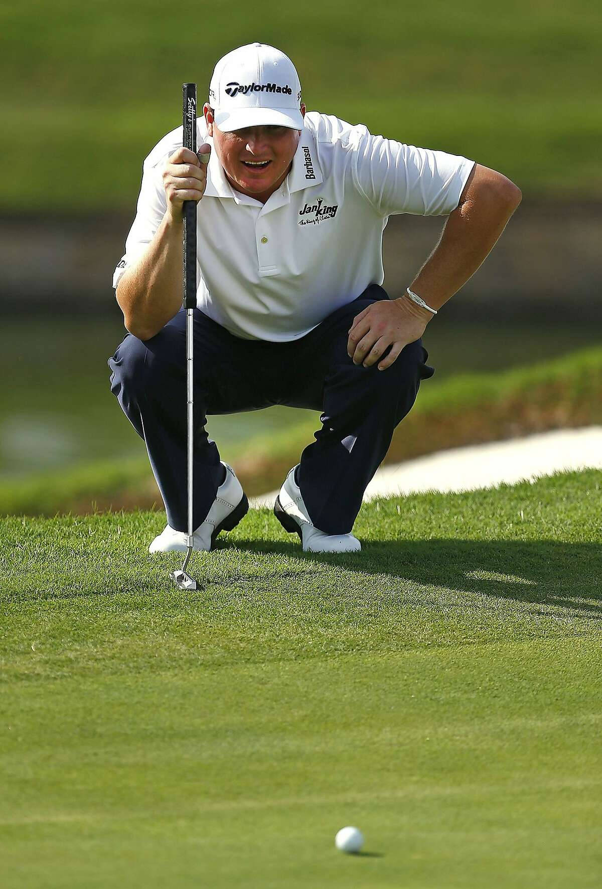 Chad Campbell Focused On His Ball In Golf Game Wallpaper