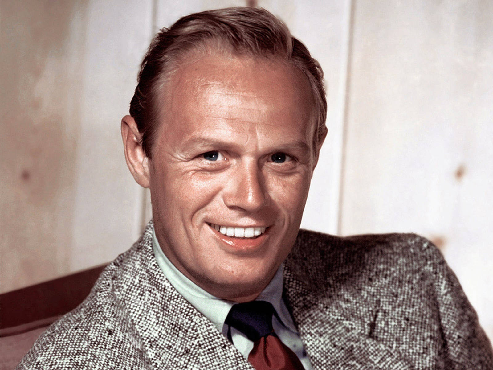 Charismatic Hollywood Icon, Richard Widmark With Wide Smile Wallpaper