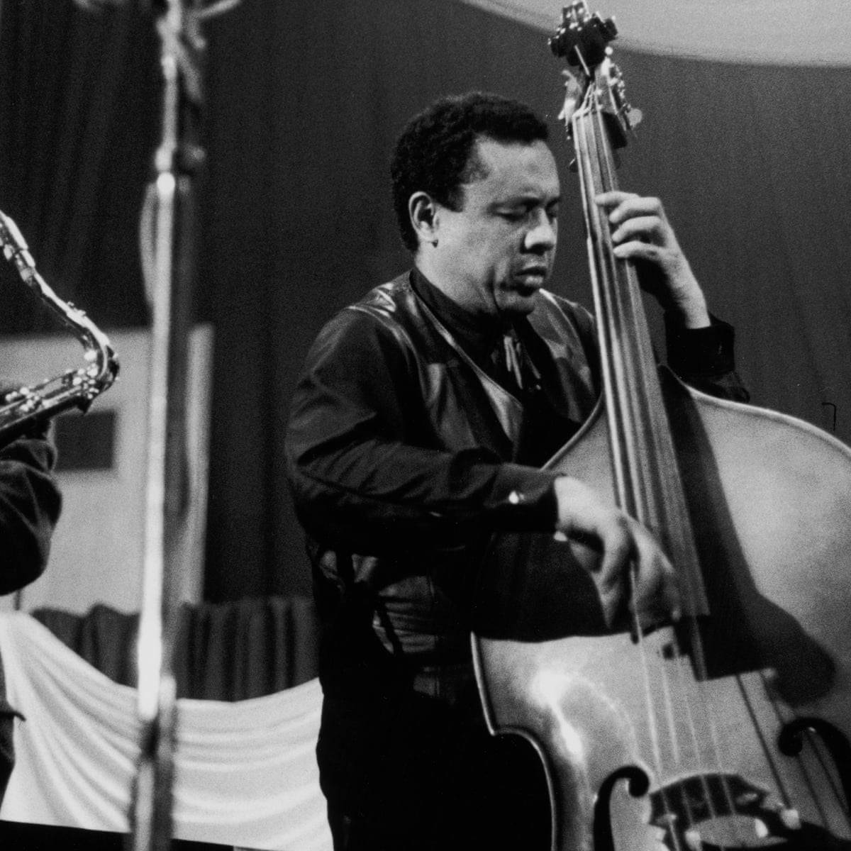 Charles Mingus Passionately Playing Guitarron Wallpaper