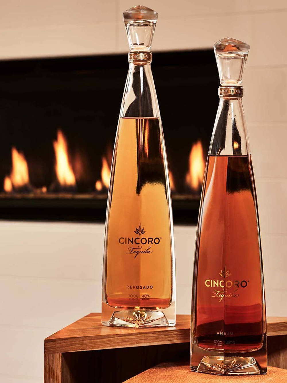 Cincoro Tequila Reposado And Añejo With Fire Display On Tv Wallpaper