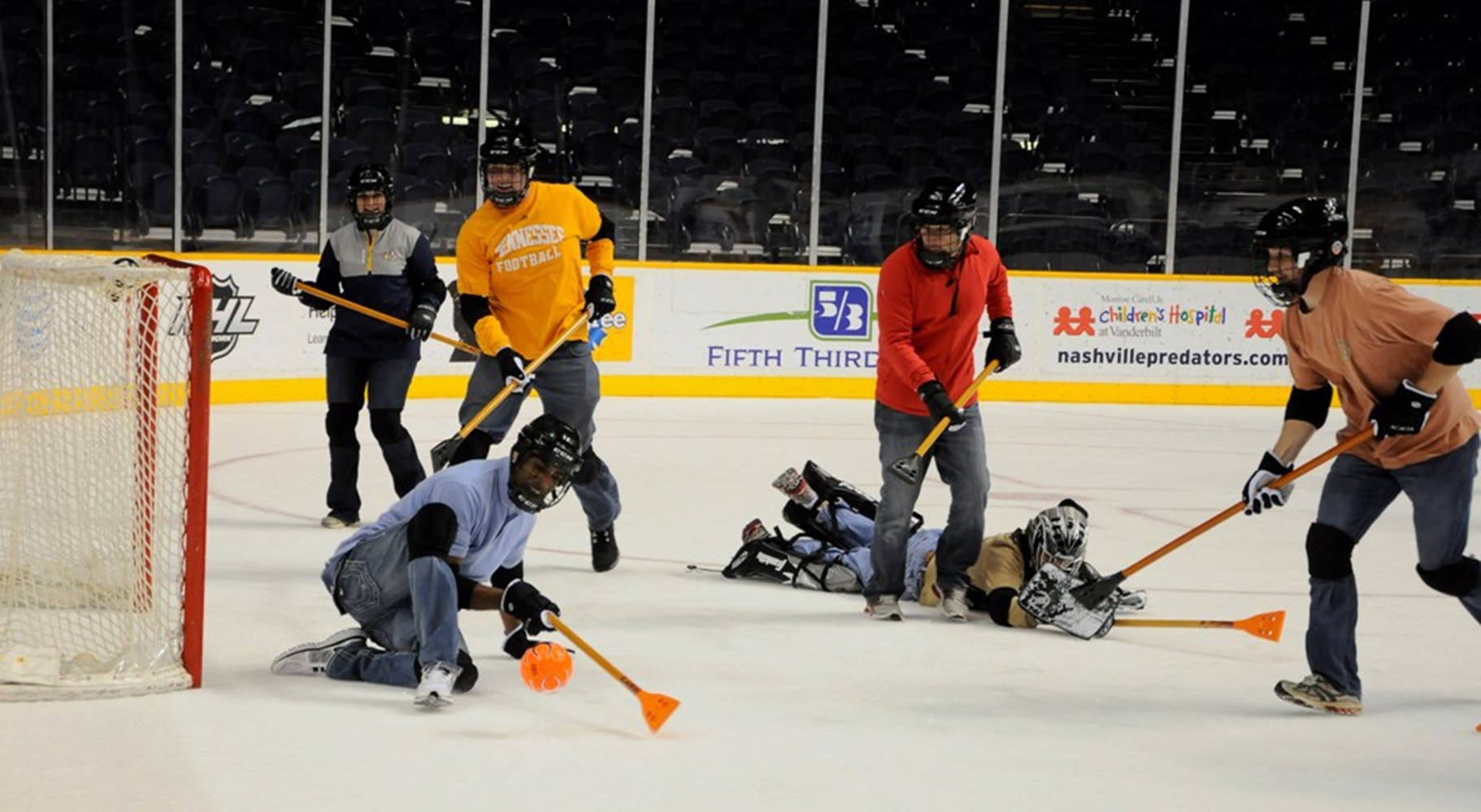 Competitive Broomball Team In Action Wallpaper