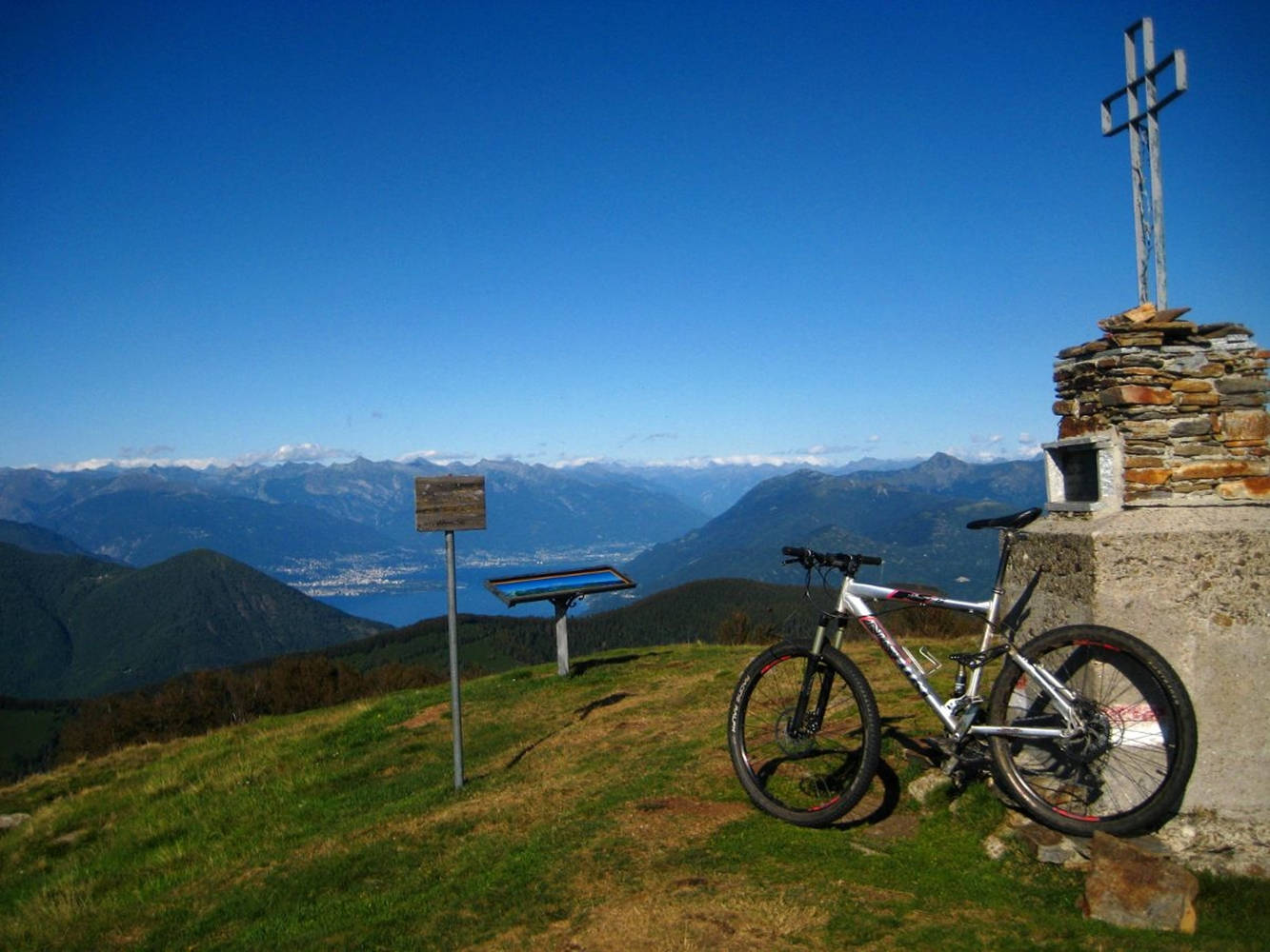 Conquering The Mountain Peak On An Mtb Wallpaper