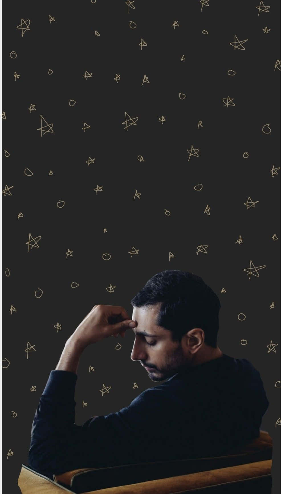 Contemplative_ Man_ Against_ Star_ Pattern_ Background Wallpaper