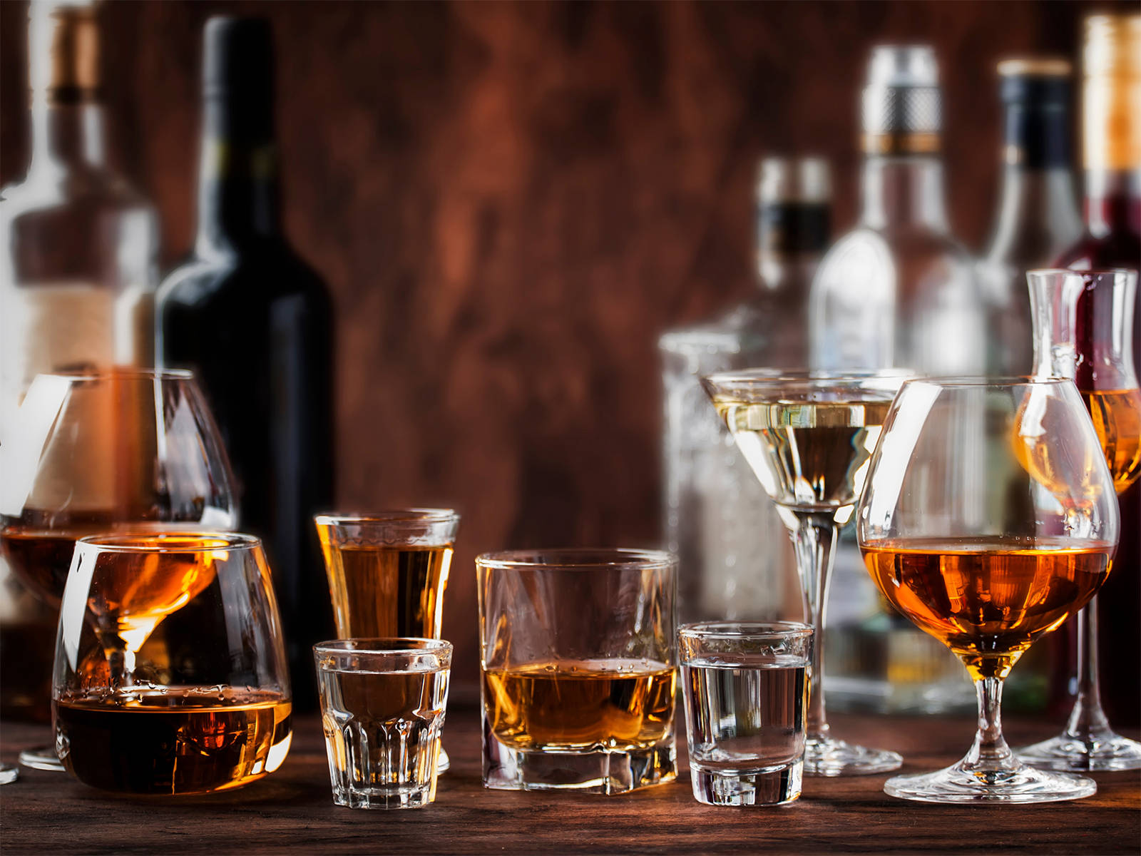 Cordial Drinks Displayed Elegantly On The Bar Wallpaper