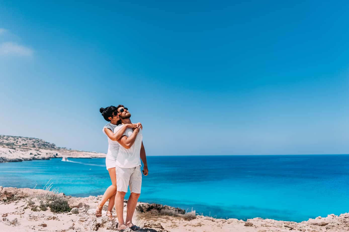 Couple At Beach Blue Skies Wallpaper