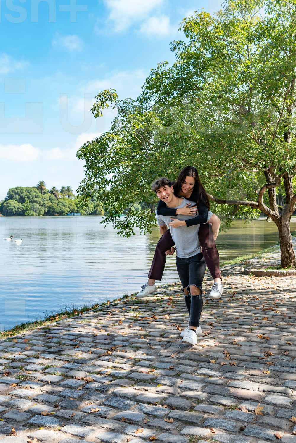 Couple At Beach Piggyback Ride Wallpaper