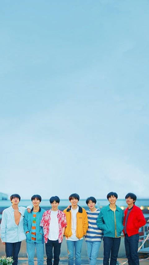 Cute Bts Group By The Sea Wide Shot Wallpaper