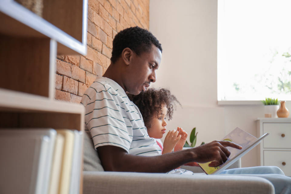 Dad And Daughter Reading Wallpaper