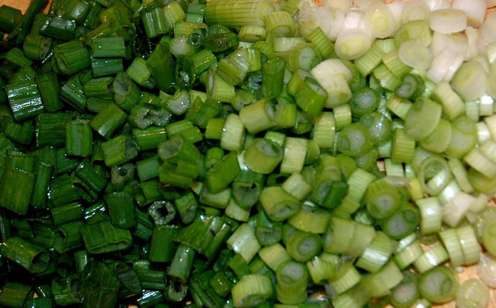 Damp Chopped Pieces Of Spring Onion Wallpaper