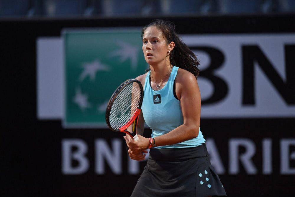 Daria Kasatkina In Blue Holding Racket Wallpaper