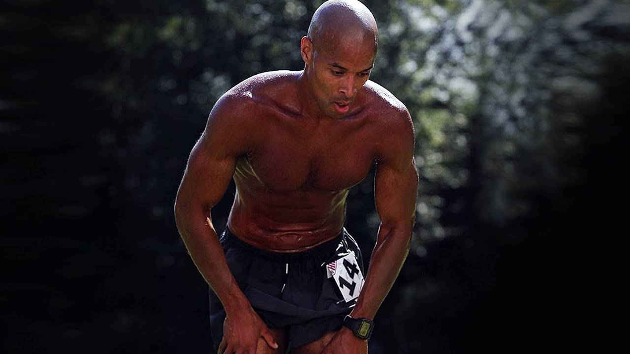 David Goggins Resting During Marathon Wallpaper