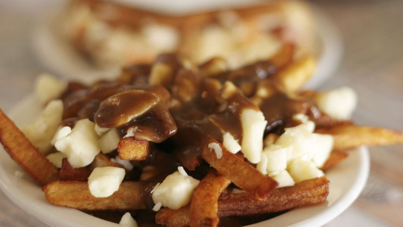 Decadent Poutine With Rich Gravy Wallpaper