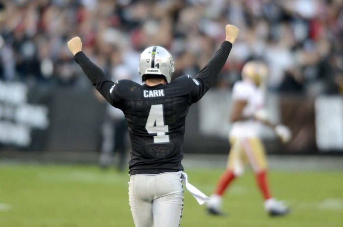 Derek Carr Cheering In The Stadium Wallpaper