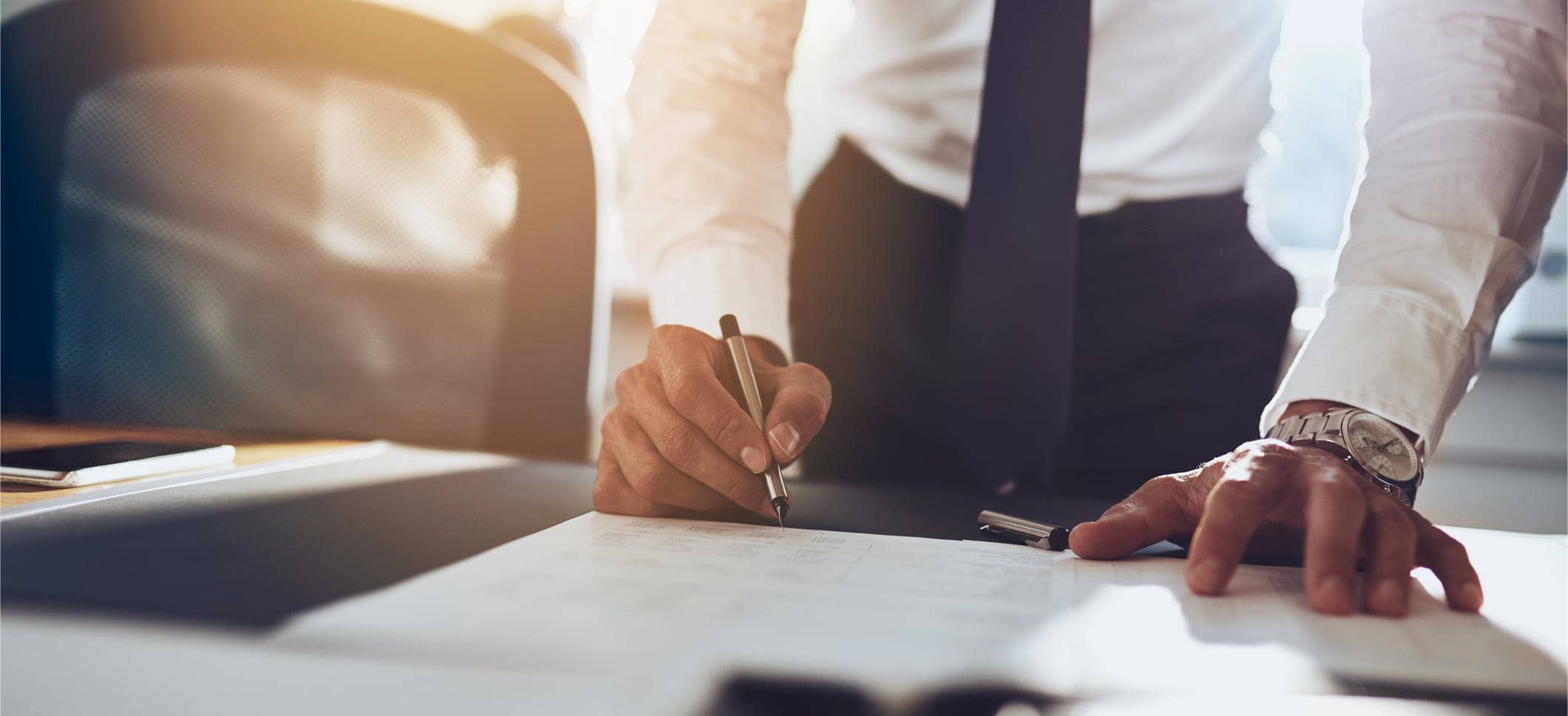 Diligent Lawyer Reviewing Legal Documents Wallpaper