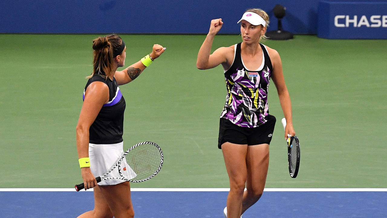 Elise Mertens Fist Bump With Doubles Partner Wallpaper