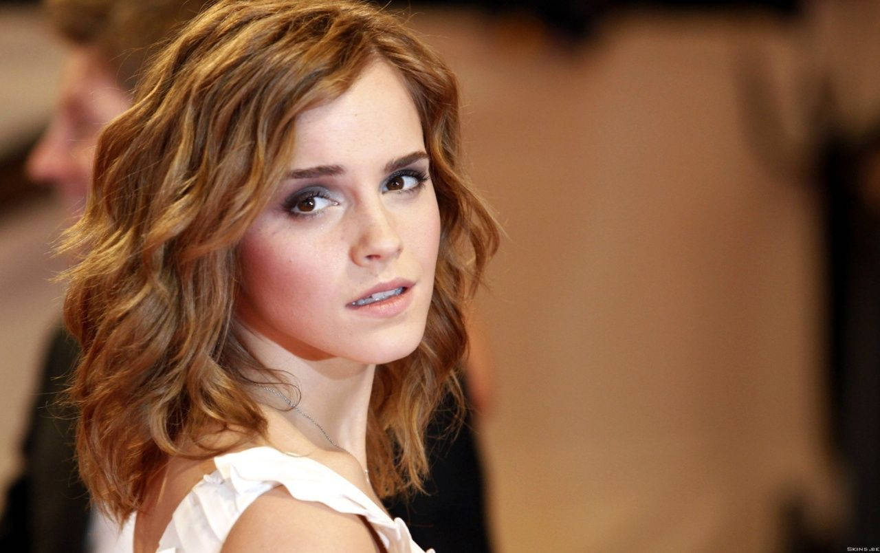 Emma Watson Taking A Refreshing Glance Back Wallpaper
