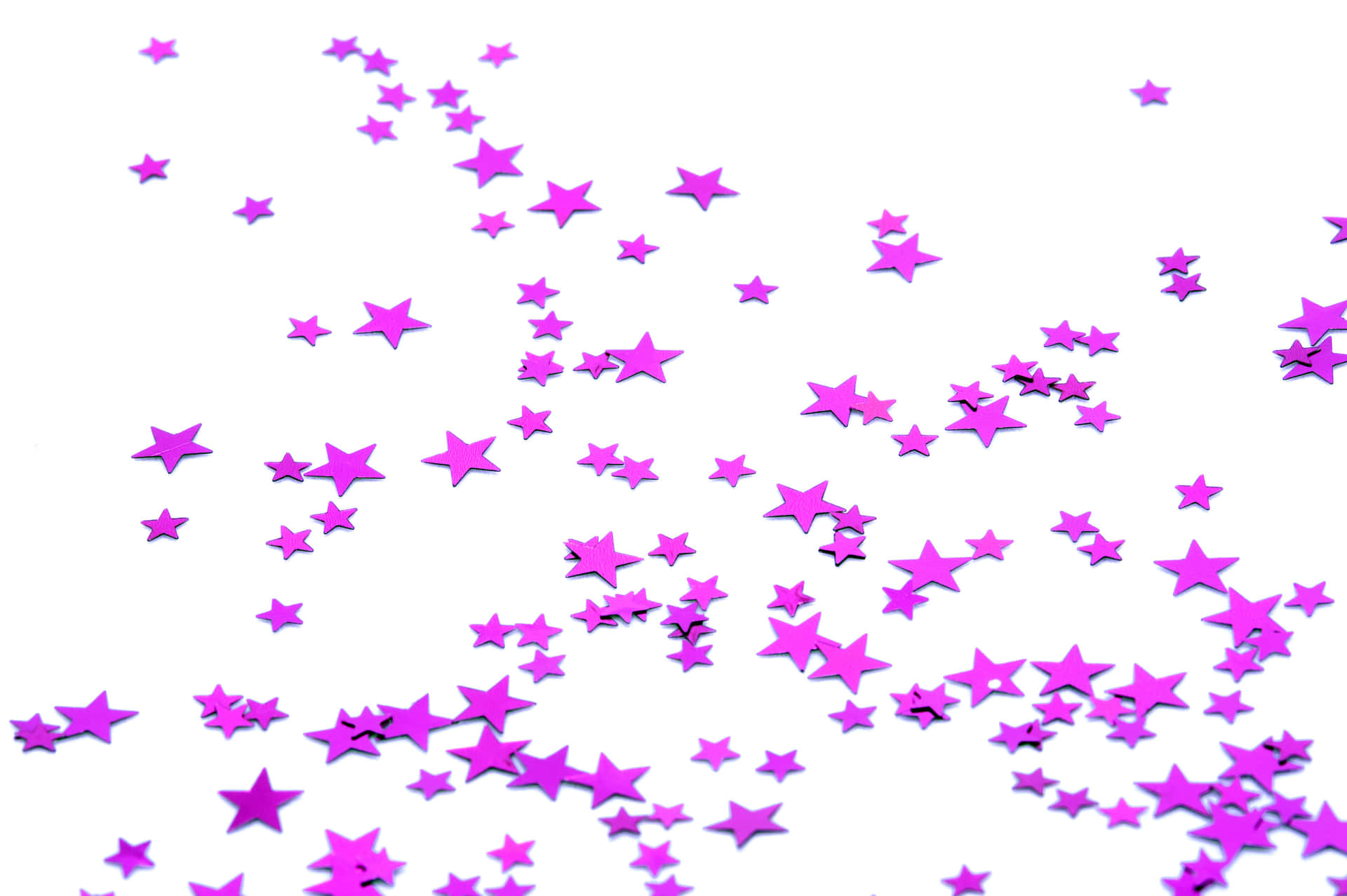 Enchanting Pink Stars In The Night Sky Wallpaper