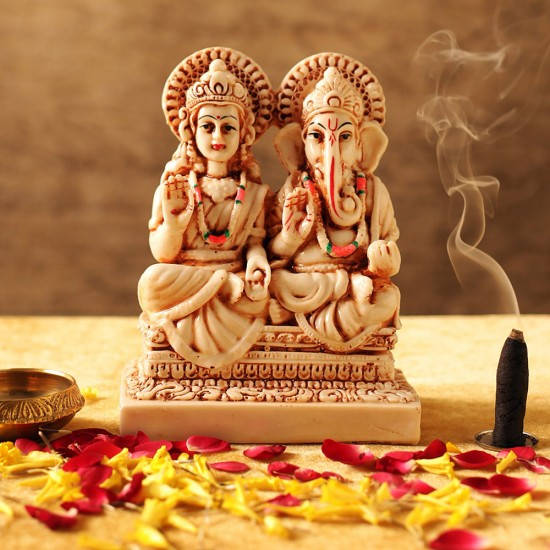 Enchanting Sculpture Of Ganesh Lakshmi Wallpaper