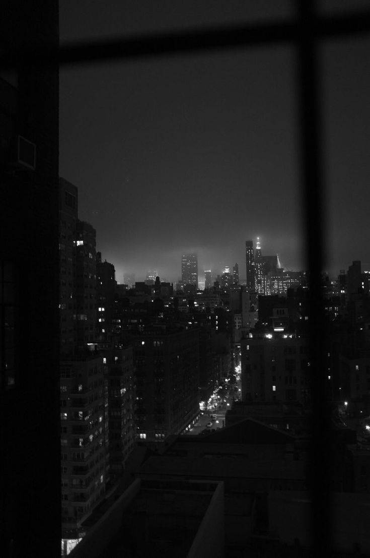 Enigmatic Urban Nightlife In Monochrome Wallpaper