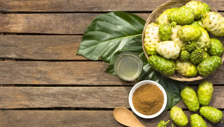 Enlightening Taste Of Wellness - Noni Fruits And Coffee Powder Wallpaper