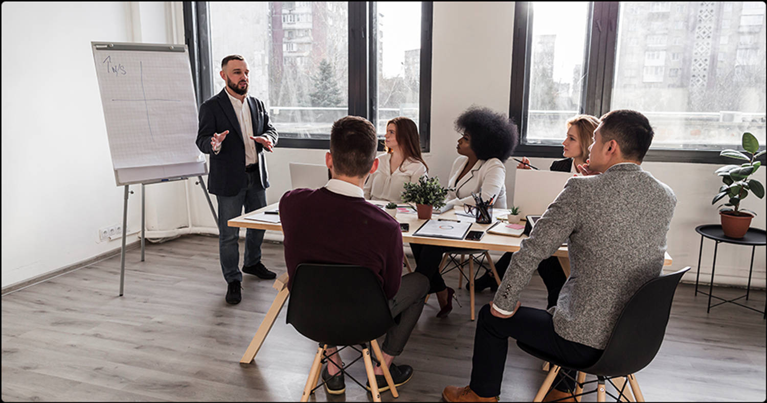 Enterprise Employees And Partners In Meeting Wallpaper