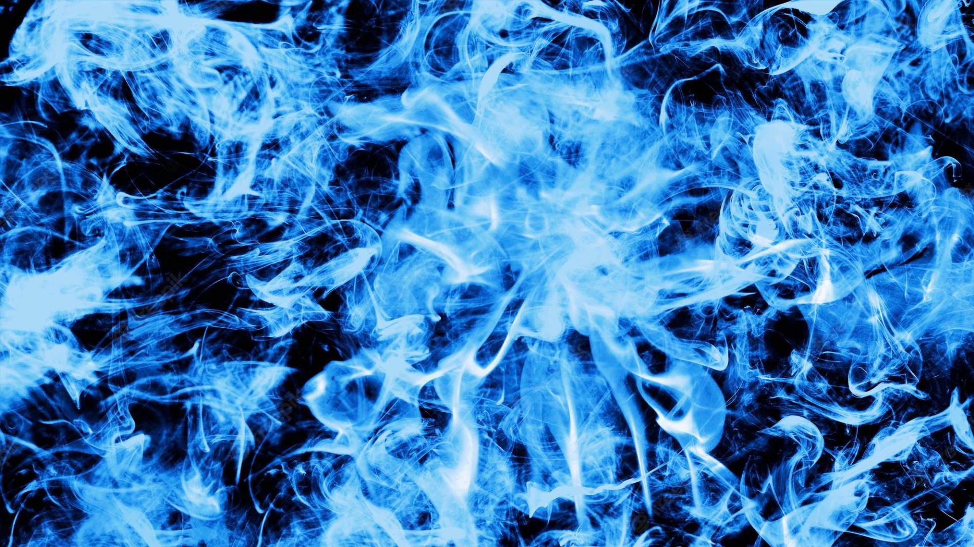 Enthralling Display Of Blue Flames In Darkness Wallpaper