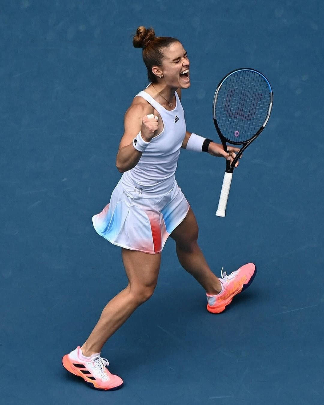 Enthusiastic Maria Sakkari Celebrating Victory On Court Wallpaper