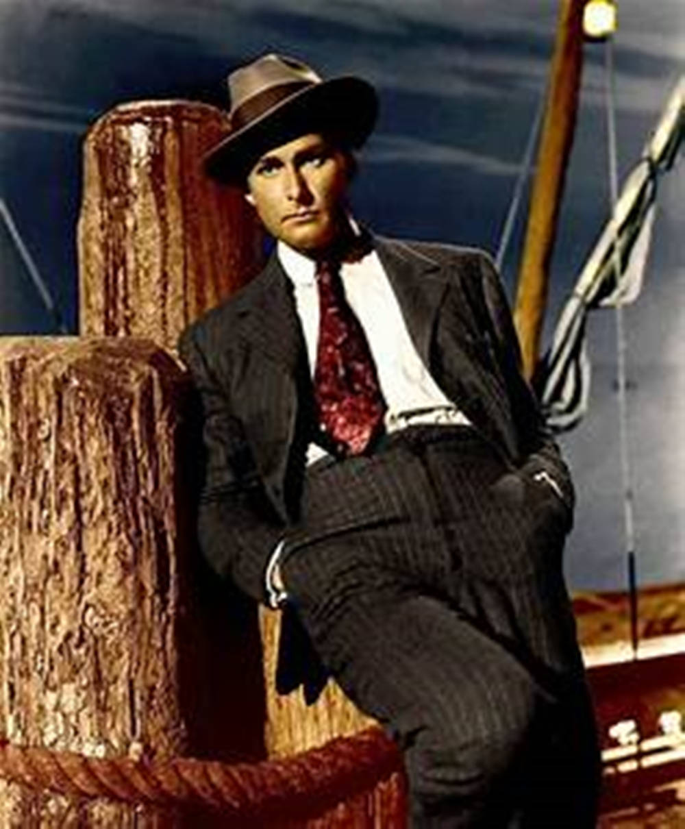 Errol Flynn Colored In Hat And Suit Wallpaper