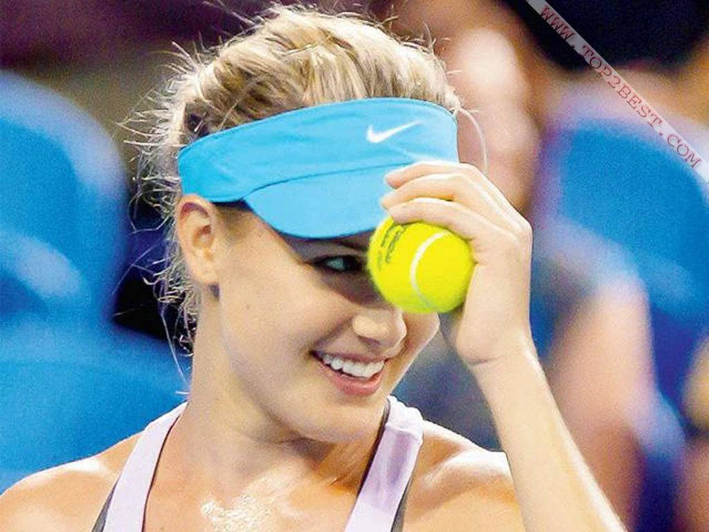 Eugenie Bouchard Adjusting Her Visor On The Field Wallpaper