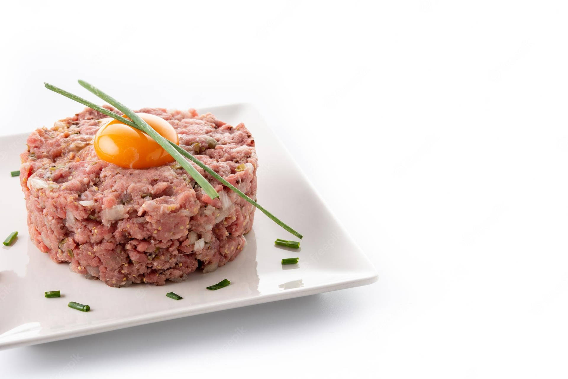 Exquisite Steak Tartare With Vibrant Yolk On Top Wallpaper