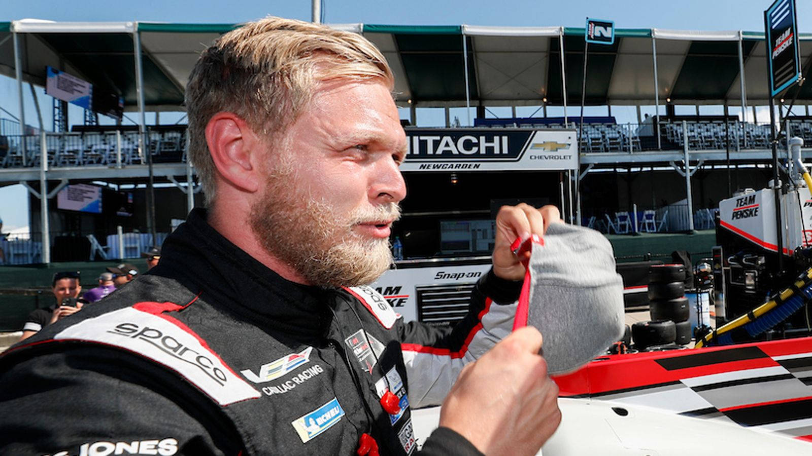 F1 Driver Kevin Magnussen Adjusting His Racing Cap Wallpaper