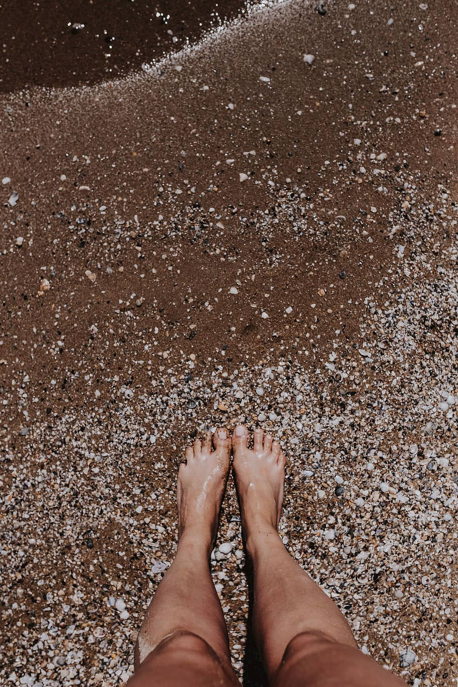 Female Legs Model On Brown Sand Wallpaper