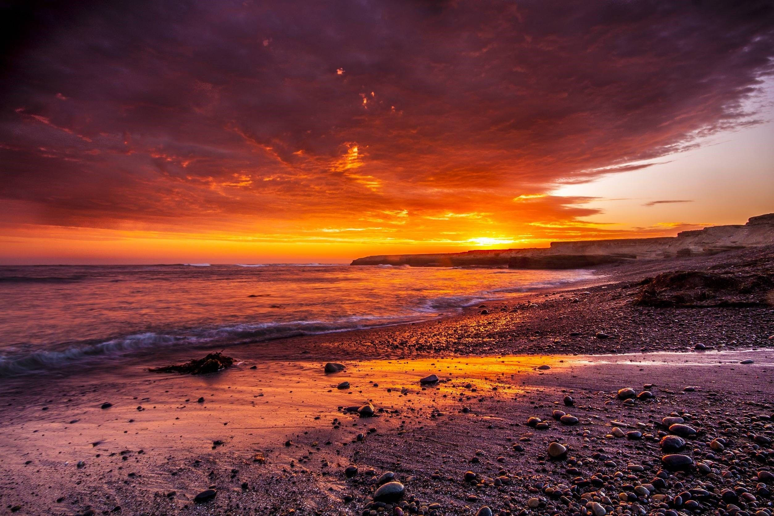 Fiery Orange Aesthetic Sunset At Beach Wallpaper