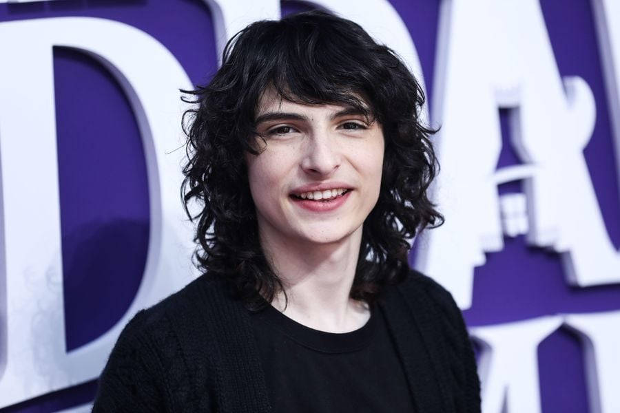 Finn Wolfhard Addams Family Carpet Wallpaper