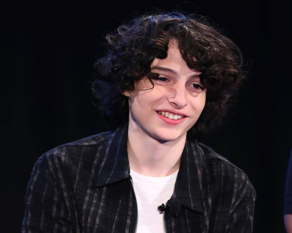 Finn Wolfhard On Stage Wallpaper