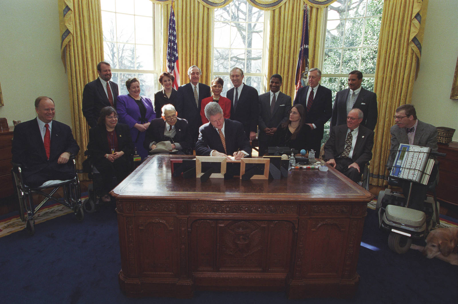 Former President Bill Clinton Signing An Agreement Wallpaper