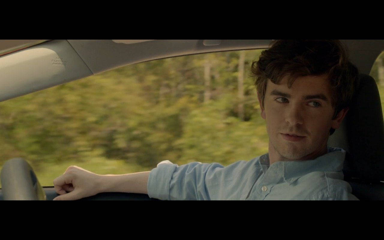 Freddie Highmore Casually Leans On A Car Wallpaper