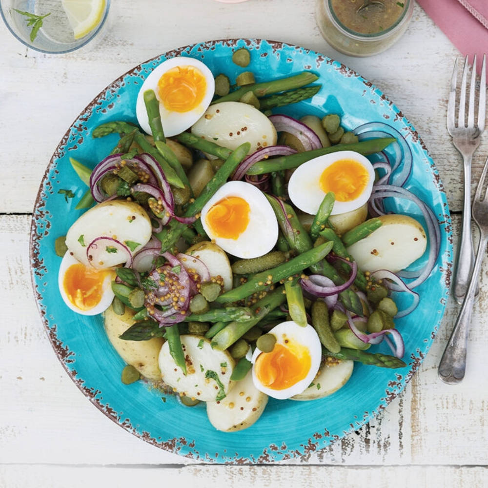 Fresh, Healthy Green Salad Adorned With Boiled Eggs Wallpaper